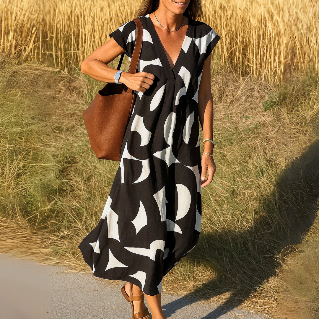 Amina™ Jurk – Zomerse Vrijheid met Grafische Print