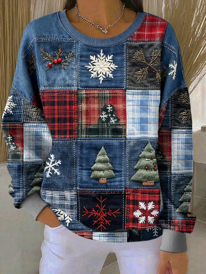 Nora - Kersttrui met patchworkprint
